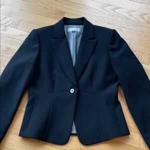 Worn once. Black textured fabric. Beautifully lined and tailored.